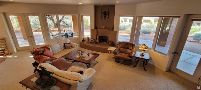 1657 N Kayenta Dr, Ivins, UT 84738 - carpeted living room featuring recessed lighting, french doors, and a fireplace with raised hearth
