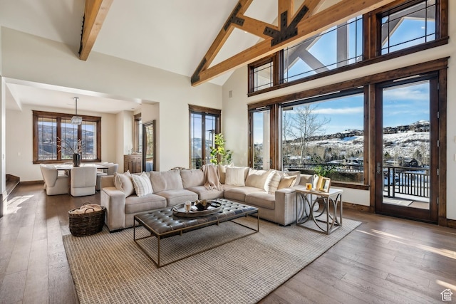 9255 Par Ct, Park City, UT 84098 - living room with beam ceiling, high vaulted ceiling, baseboards, and hardwood / wood-style flooring
