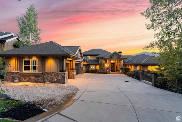 9255 Par Ct, Park City, UT 84098 - prairie-style home featuring a garage, stone siding, board and batten siding, and driveway