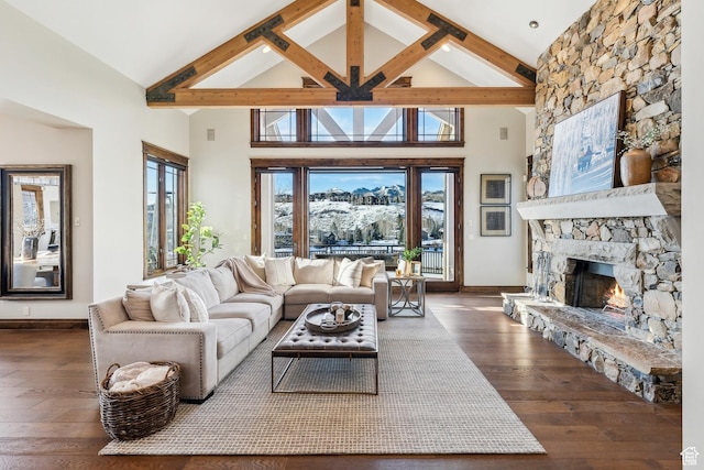 9255 Par Ct, Park City, UT 84098 - living room featuring beamed ceiling, a fireplace, and hardwood / wood-style flooring