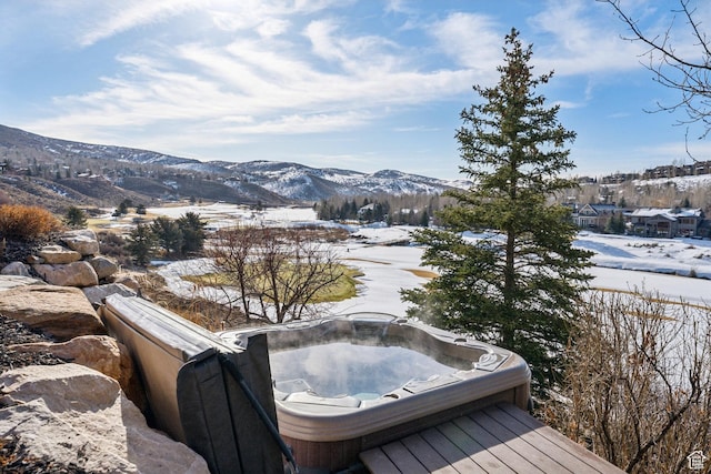 9255 Par Ct, Park City, UT 84098 - snow covered deck with an outdoor hot tub and a mountain view