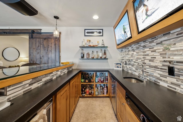 9255 Par Ct, Park City, UT 84098 - bar with tasteful backsplash, a barn door, indoor wet bar, hanging light fixtures, and a sink