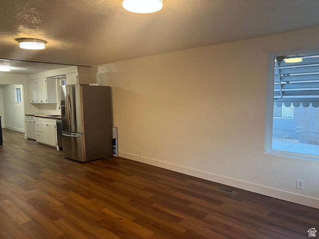 735 Castle Gate Rd, Helper, UT 84526 - kitchen with dark wood-style flooring, white cabinetry, stainless steel refrigerator with ice dispenser, and baseboards