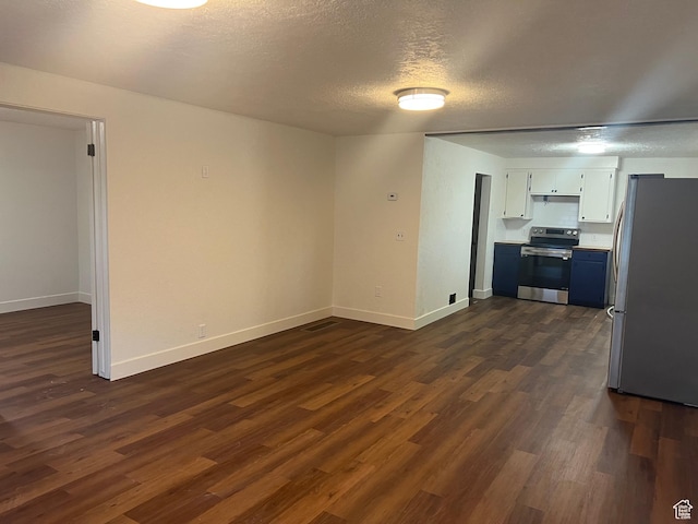 735 Castle Gate Rd, Helper, UT 84526 - interior space featuring a textured ceiling, baseboards, and dark wood-type flooring