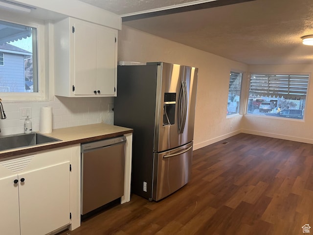 735 Castle Gate Rd, Helper, UT 84526 - kitchen with appliances with stainless steel finishes, dark wood finished floors, white cabinetry, and a sink