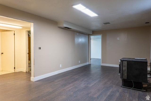 735 Castle Gate Rd, Helper, UT 84526 - finished basement featuring dark wood-style floors, visible vents, and baseboards