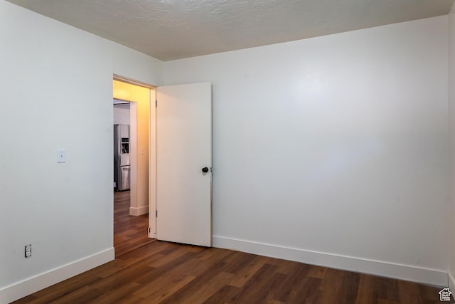 735 Castle Gate Rd, Helper, UT 84526 - empty room featuring a textured ceiling, baseboards, and wood finished floors
