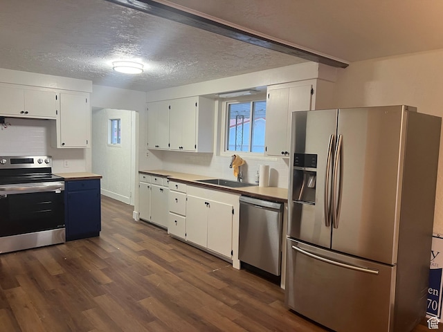 735 Castle Gate Rd, Helper, UT 84526 - kitchen featuring dark wood-style floors, stainless steel appliances, a sink, and white cabinets