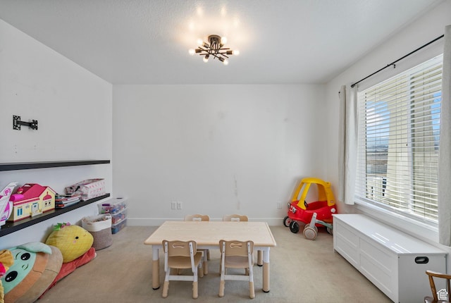 134 N Eden Brook Way, Saratoga Springs, UT 84045 - playroom featuring light carpet, baseboards, and a notable chandelier
