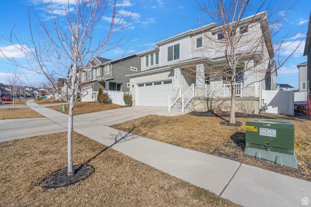134 N Eden Brook Way, Saratoga Springs, UT 84045 - view of front of property with an attached garage, covered porch, fence, driveway, and a residential view