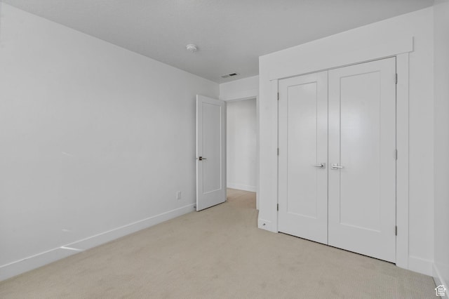 134 N Eden Brook Way, Saratoga Springs, UT 84045 - unfurnished bedroom featuring baseboards, a closet, visible vents, and light colored carpet