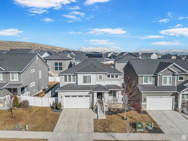134 N Eden Brook Way, Saratoga Springs, UT 84045 - view of front of home with a residential view, concrete driveway, and fence