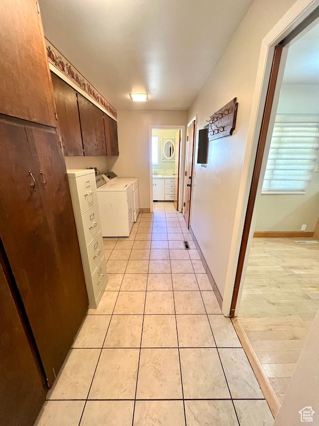 305 N 200 E, Elsinore, UT 84724 - laundry area featuring baseboards, light tile patterned flooring, cabinet space, and washer and dryer