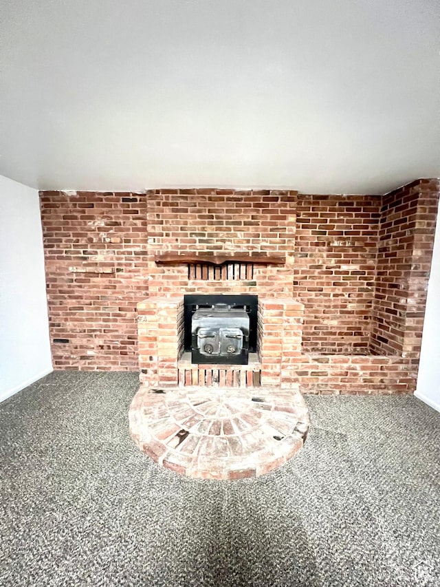 305 N 200 E, Elsinore, UT 84724 - unfurnished living room with carpet and brick wall