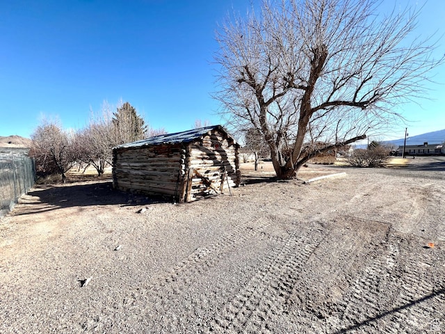 305 N 200 E, Elsinore, UT 84724 - view of yard with an outbuilding, a mountain view, fence, and a storage unit
