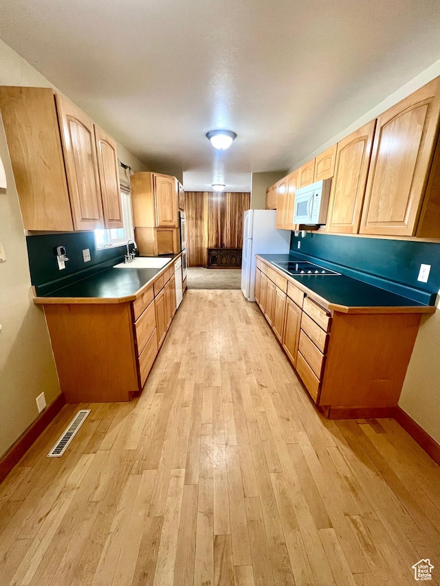 305 N 200 E, Elsinore, UT 84724 - kitchen featuring light wood-style flooring, white appliances, a sink, visible vents, and light brown cabinetry