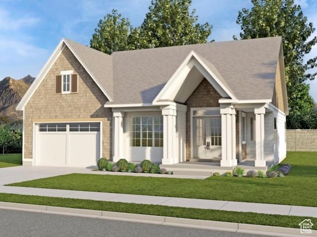 view of front facade with a garage, a front yard, and concrete driveway