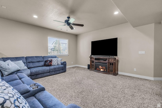 990 W Adams Cir, Bluffdale, UT 84065 - carpeted living area featuring recessed lighting, ceiling fan, a lit fireplace, and baseboards