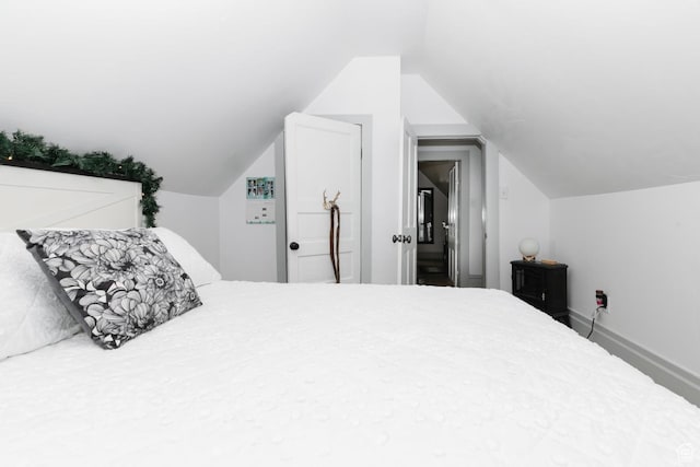 bedroom with lofted ceiling