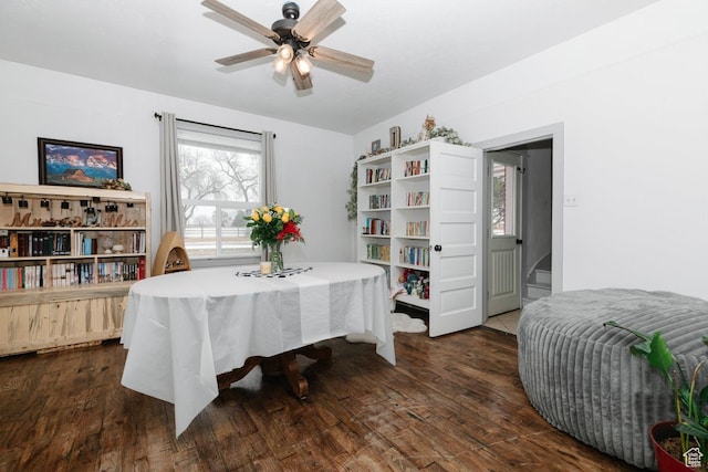 dining area with ceiling fan and dark wood-style flooring