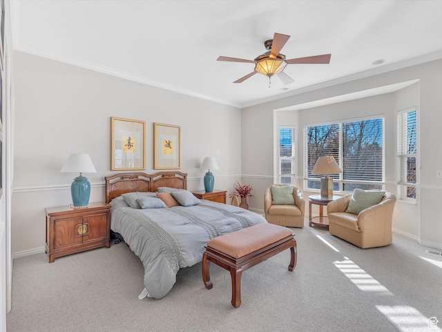 bedroom featuring carpet floors, ornamental molding, a ceiling fan, and baseboards