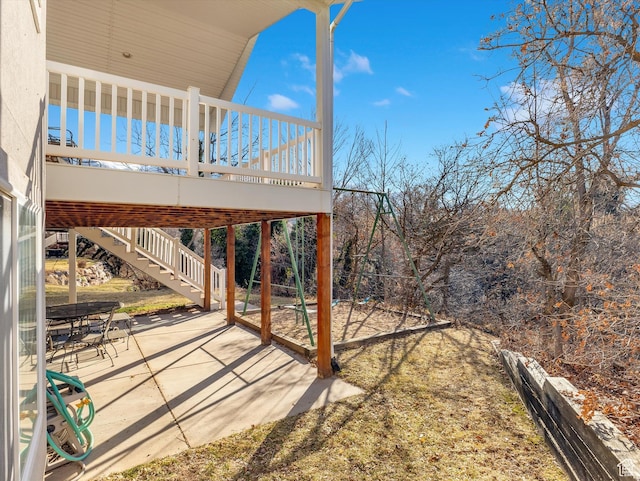 view of patio / terrace with a deck and stairway
