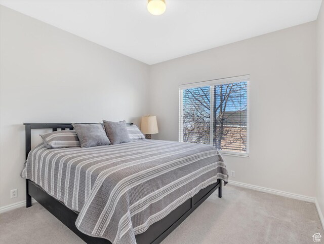 carpeted bedroom with baseboards