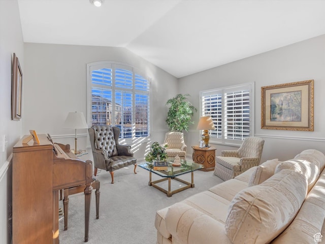 living room with carpet floors and lofted ceiling