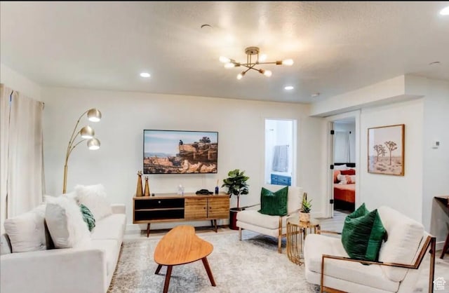 living room featuring recessed lighting and an inviting chandelier