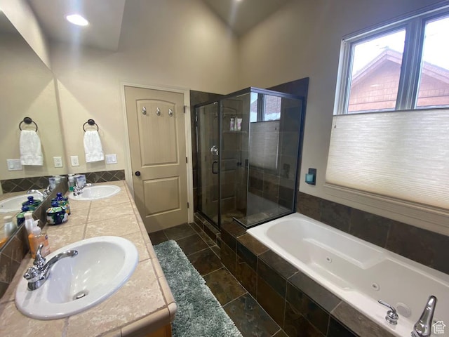 3435 Big Piney Dr, Eden, UT 84310 - bathroom with a whirlpool tub, double vanity, a sink, and a shower stall