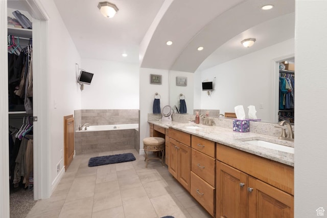 315 S 300 E, Monroe, UT 84754 - full bathroom featuring double vanity, a bath, recessed lighting, tile patterned flooring, and a walk in closet