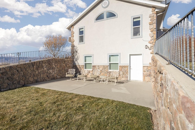315 S 300 E, Monroe, UT 84754 - back of property featuring stone siding, stucco siding, and a patio
