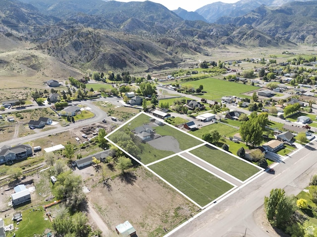 315 S 300 E, Monroe, UT 84754 - aerial overview of property's location with property boundaries highlighted and a mountainous background