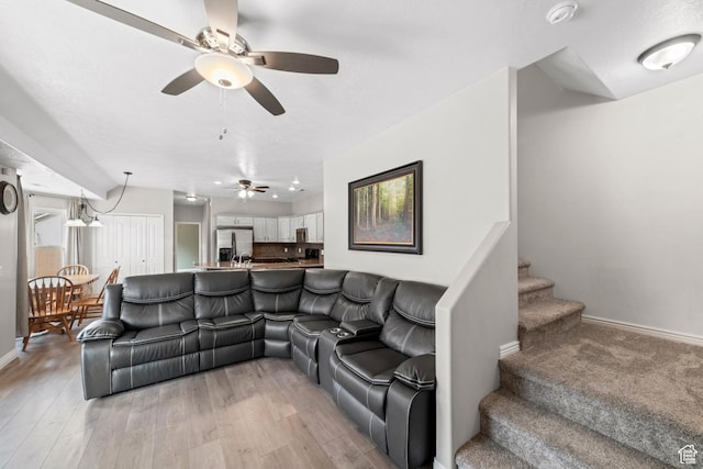 187 N Stone Mountain Dr, St George, UT 84770 - living room with a ceiling fan, stairway, light wood-style flooring, and baseboards