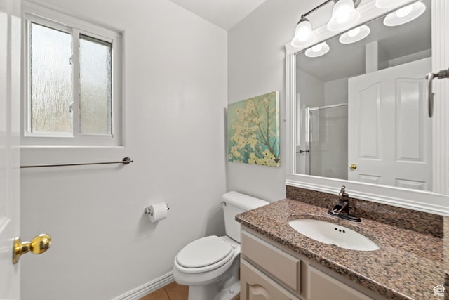 187 N Stone Mountain Dr, St George, UT 84770 - bathroom featuring vanity, a shower with shower door, toilet, tile patterned floors, and baseboards