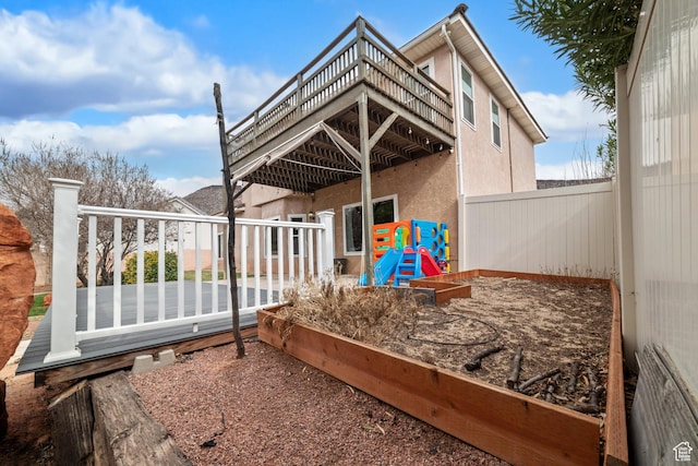 187 N Stone Mountain Dr, St George, UT 84770 - back of property with stucco siding and a wooden deck