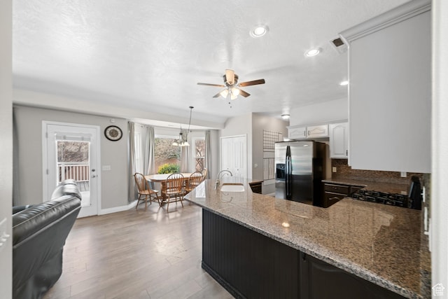 187 N Stone Mountain Dr, St George, UT 84770 - kitchen featuring stainless steel fridge, range with gas cooktop, a sink, a ceiling fan, and a peninsula