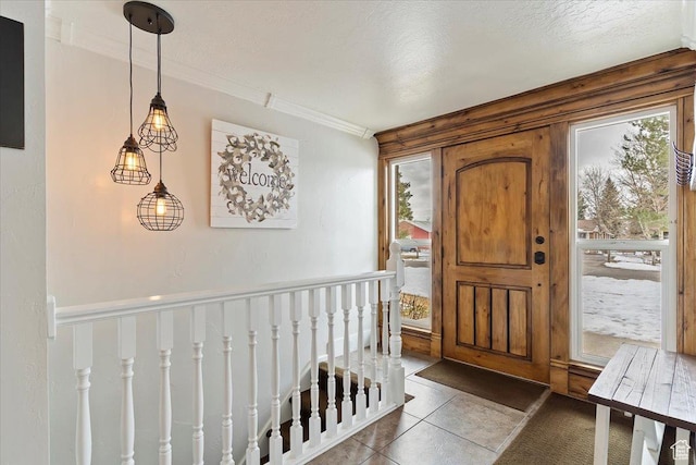 4884 E 2800 N, Eden, UT 84310 - tiled foyer featuring a healthy amount of sunlight, a textured ceiling, and crown molding