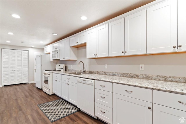 4884 E 2800 N, Eden, UT 84310 - kitchen with white appliances, a sink, dark wood finished floors, and white cabinets