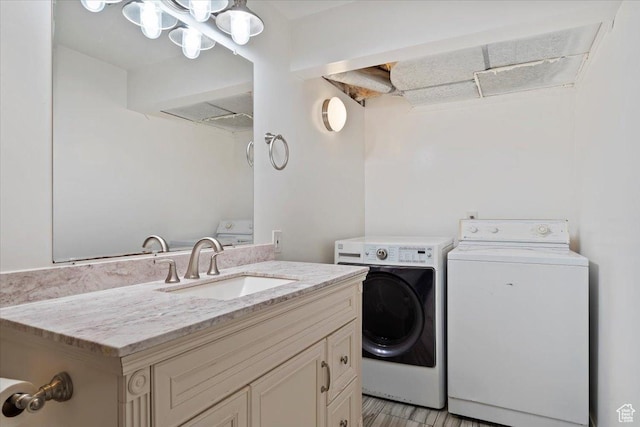 4884 E 2800 N, Eden, UT 84310 - clothes washing area featuring laundry area, washer and clothes dryer, and a sink