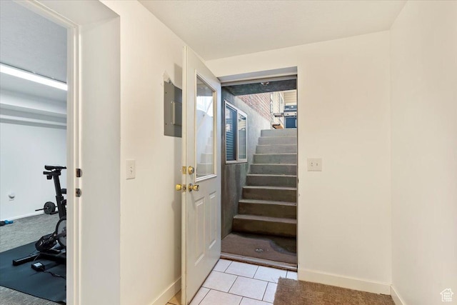 4884 E 2800 N, Eden, UT 84310 - entryway featuring light carpet, light tile patterned floors, stairs, and baseboards