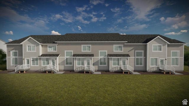 rear view of house with a yard
