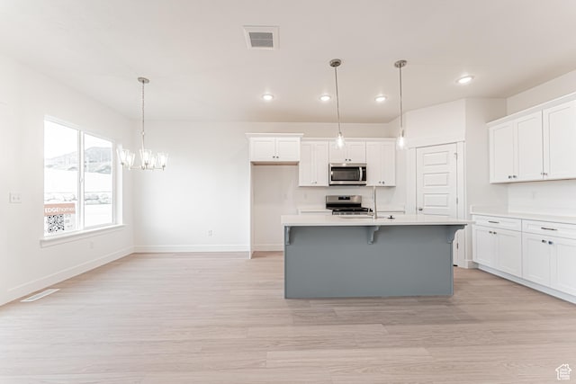 684 W 4500 S Unit 313, Mapleton, UT 84664 - kitchen with appliances with stainless steel finishes, recessed lighting, white cabinets, and light wood-type flooring