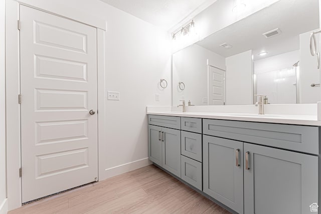 684 W 4500 S Unit 313, Mapleton, UT 84664 - full bathroom featuring double vanity and wood finished floors