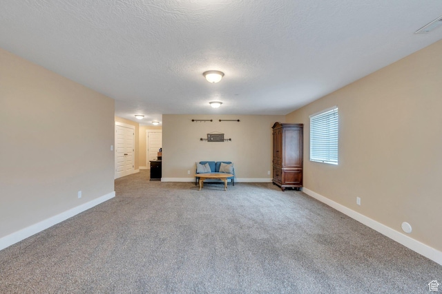 80 Pheasant, Elk Ridge, UT 84651 - living area with carpet floors, baseboards, and a textured ceiling