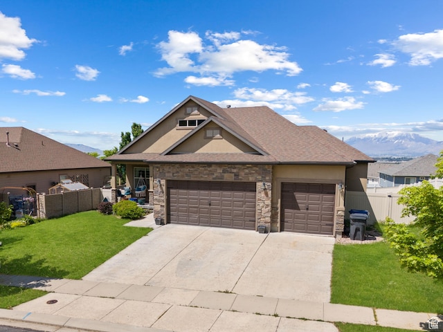 80 Pheasant, Elk Ridge, UT 84651 - view of front of house with stucco siding, stone siding, a garage, and driveway