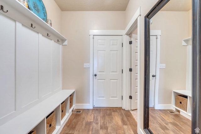 80 Pheasant, Elk Ridge, UT 84651 - mudroom featuring light wood-style floors and baseboards
