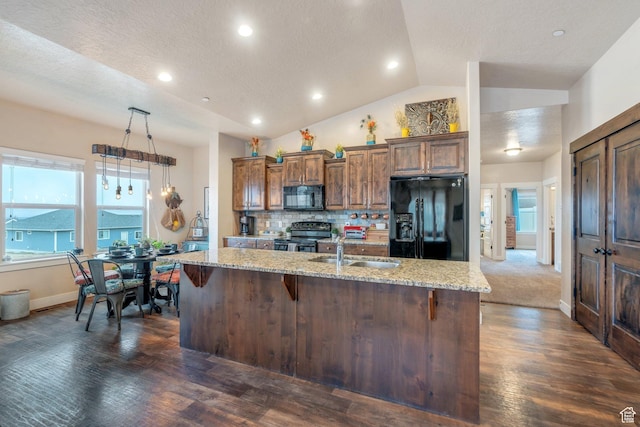80 Pheasant, Elk Ridge, UT 84651 - kitchen with black appliances, a sink, a center island with sink, light stone countertops, and vaulted ceiling