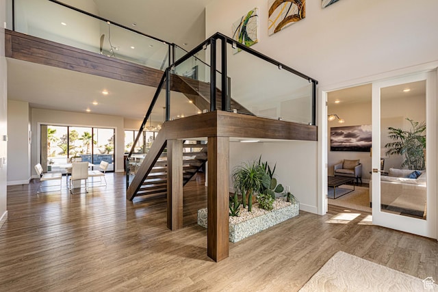 4061 S 2420 E Unit 74, St George, UT 84790 - stairs with a high ceiling, wood finished floors, and baseboards