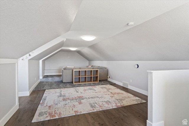 2588 S 1000 W, Nibley, UT 84321 - additional living space featuring baseboards, vaulted ceiling, wood finished floors, and a textured ceiling